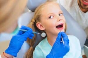 young girl having orthodontic checkup